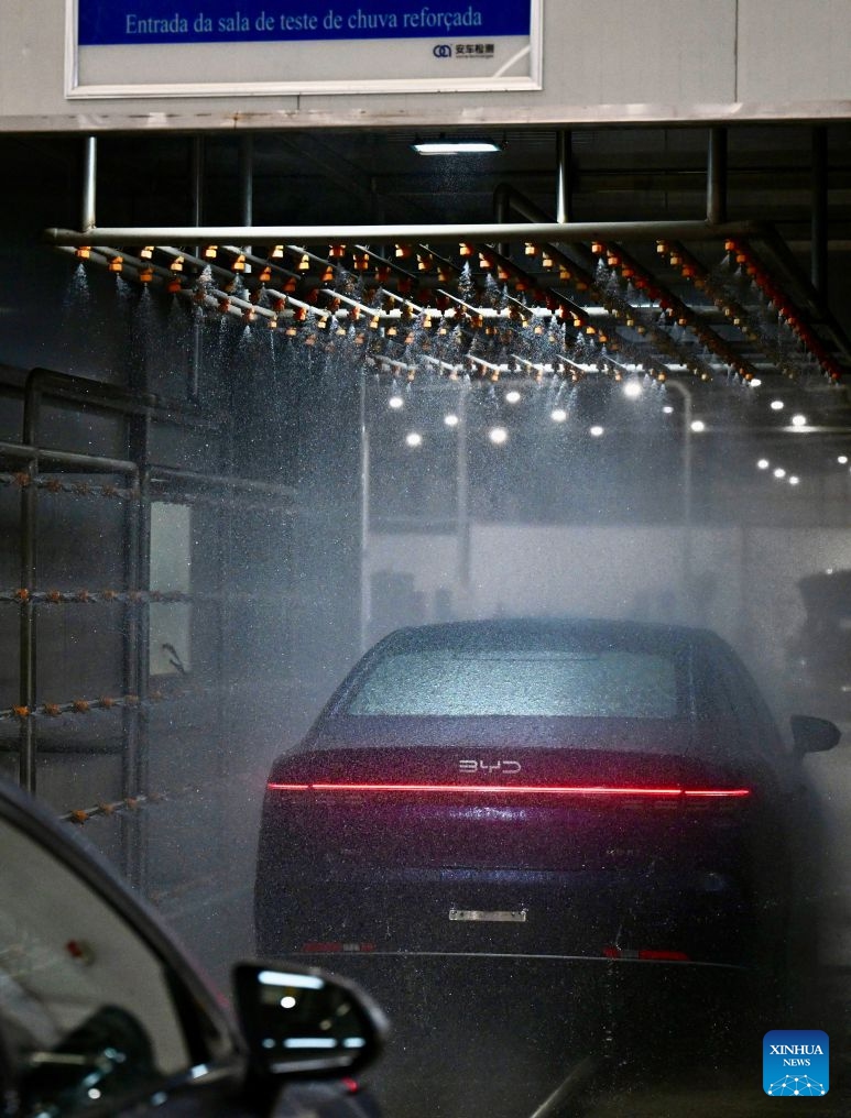 A vehicle goes through the water-spray test at the production base complex of BYD in Camacari, Bahia State, Brazil, June 15, 2026. About 50 kilometers away from Salvador, the capital of the northeastern Brazilian state of Bahia, the Camacari production base complex of Chinese auto manufacturer BYD has been put into operation since last year. (Xinhua/Jin Haoyuan)