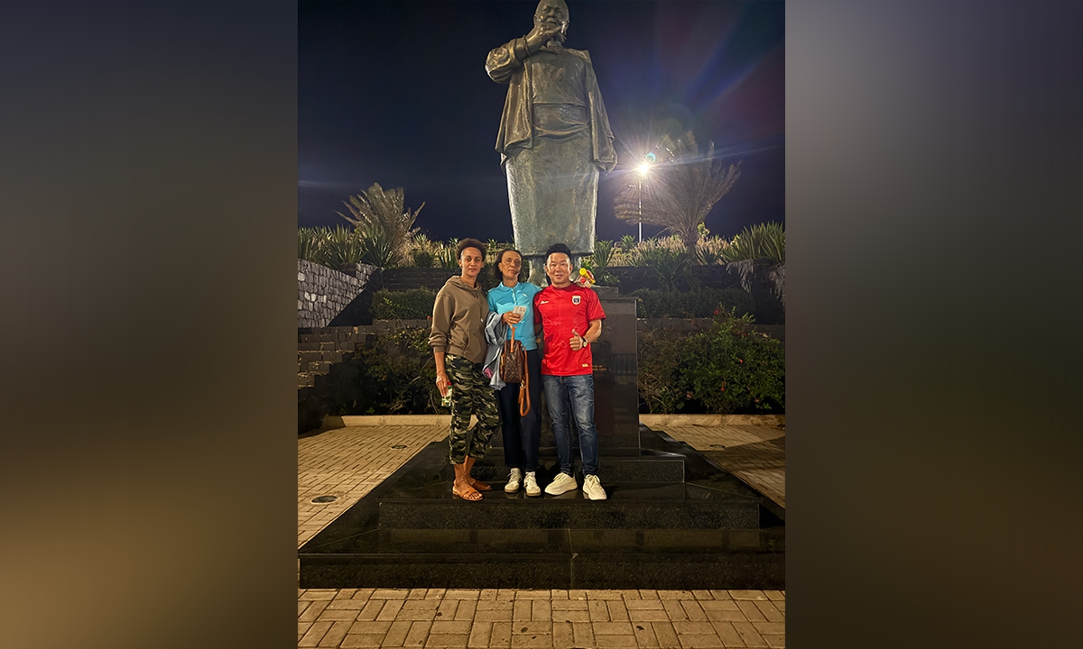 Lin Jie (right) poses with Cape Verde goalkeeper Vozinha’s cousin (left) and mother on June 17, 2026. Photo: Courtesy of Lin Jie