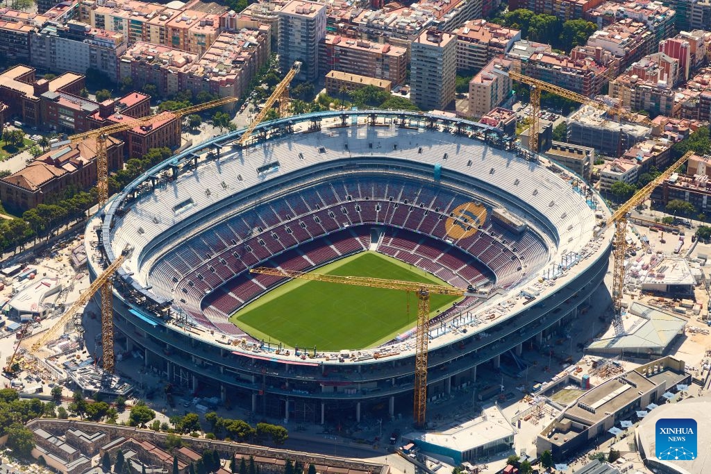 An aerial photo taken on June 18, 2026 shows the Camp Nou stadium in Barcelona, Spain. Barcelona displays its distinctive grid layout, with the Sagrada Familia Basilica rising prominently among the city blocks. Designed by urban planner Ildefons Cerda in the 19th century, the grid structure continues to shape the development and identity of the Mediterranean city. (Photo: Xinhua)