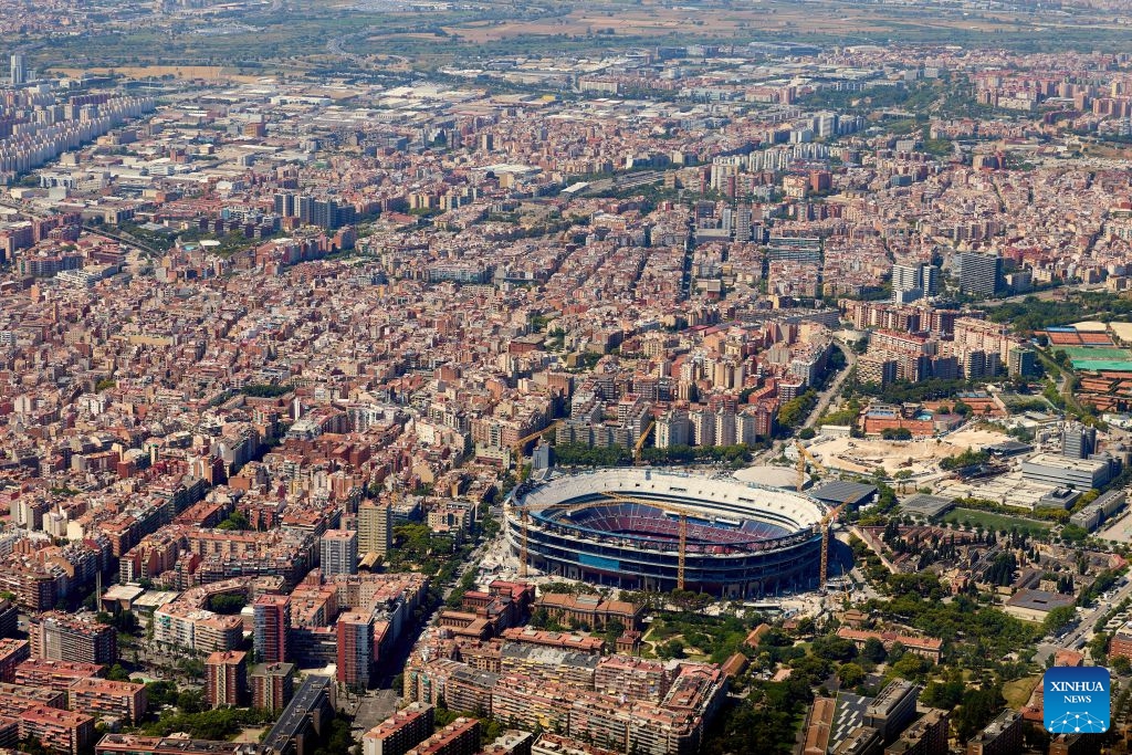 An aerial photo taken on June 18, 2026 shows the cityscape of Barcelona, Spain. Barcelona displays its distinctive grid layout, with the Sagrada Familia Basilica rising prominently among the city blocks. Designed by urban planner Ildefons Cerda in the 19th century, the grid structure continues to shape the development and identity of the Mediterranean city. (Photo: Xinhua)