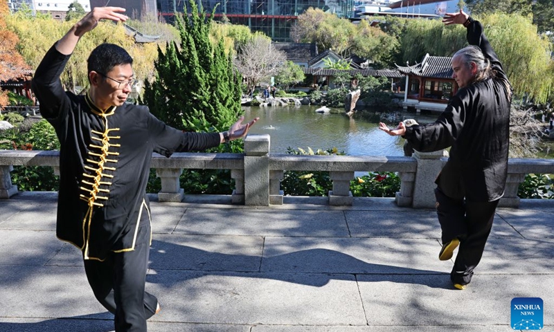 Two people perform martial arts during a fair called Tea for Harmony and Dragon Boat Festival Cultural Fair in Sydney held at a park in Sydney, Australia, June 20, 2026. Photo: Xinhua