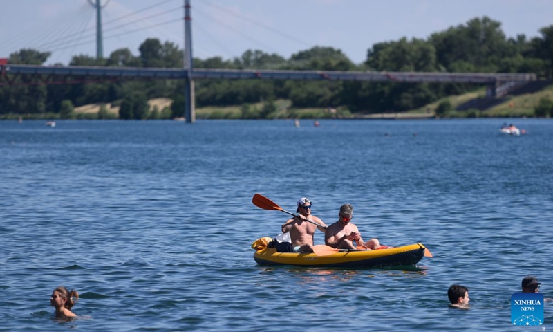 People boat on Danube river in Vienna, Austria, June 19, 2026. (Xinhua/He Canling)