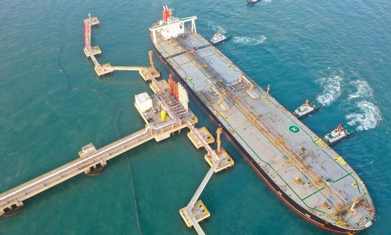 An aerial drone photo shows a vessel carrying 179,000 tonnes of petrochemical raw materials berthing at Yangpu Port in Danzhou, south China's Hainan Province, Dec. 18, 2025. (Xinhua/Guo Cheng)
