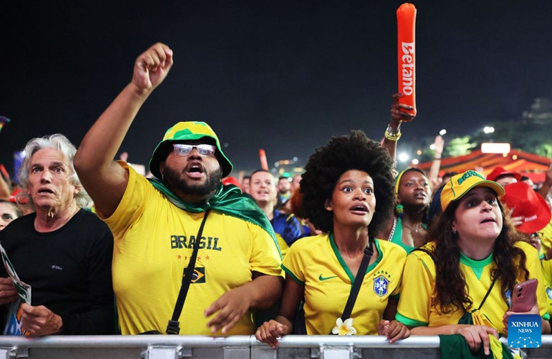 Brazilian football fans celebrate a goal while watching the live broadcast of the group C match between Brazil and Haiti at the 2026 FIFA World Cup at the Copacabana Beach in Rio de Janeiro, Brazil, on June 19, 2026. (Xinhua/Jin Haoyuan)