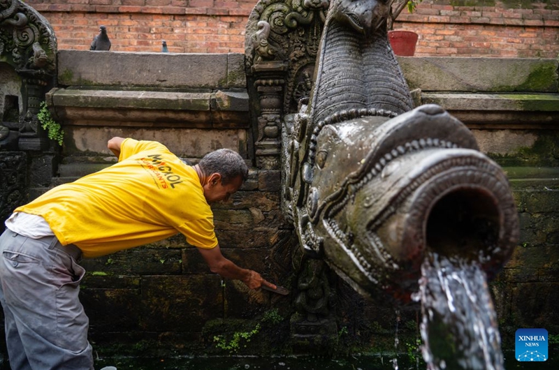A man cleans stone water spouts on the occasion of the Sithi Nakha festival in Lalitpur, Nepal, on June 20, 2026. The Newar community celebrated the Sithi Nakha festival to mark the beginning of monsoon season by cleaning water sources such as ponds, wells and stone spouts. (Photo by Hari Maharjan/Xinhua)
