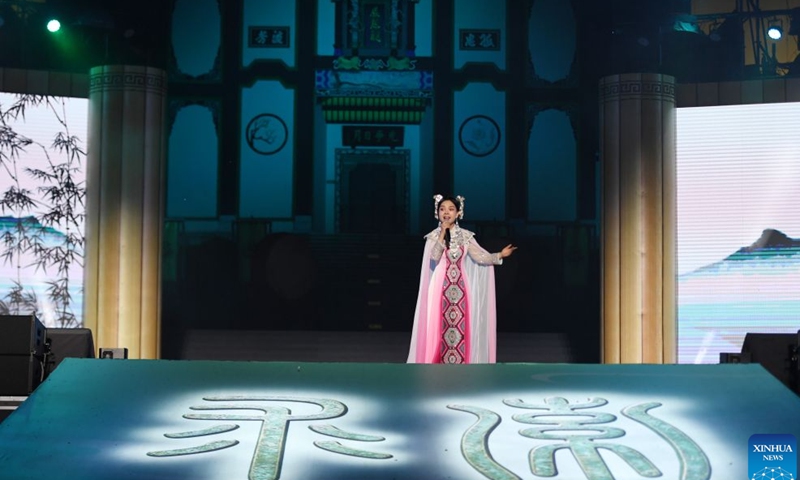 An actress performs during a poetry gathering to celebrate the Dragon Boat Festival in front of the memorial temple of Qu Yuan, a renowned patriotic poet and minister of the State of Chu during the Warring States Period (475-221 BC), in Zigui County, central China's Hubei Province, June 19, 2026. (Xinhua/Ma Ning)
