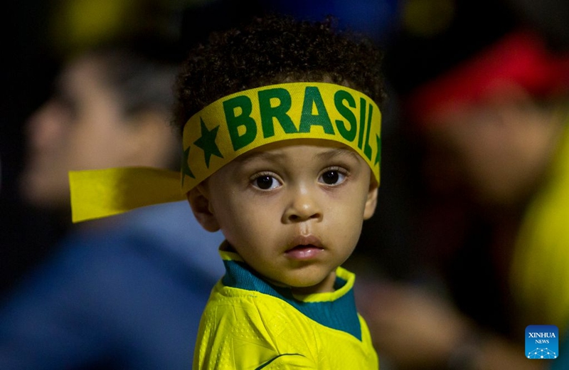 A Brazilian football fan watches the live broadcast of the group C match between Brazil and Haiti at the 2026 FIFA World Cup at the Copacabana Beach in Rio de Janeiro, Brazil, on June 19, 2026. (Photo by Daniel Ramalho/Xinhua)