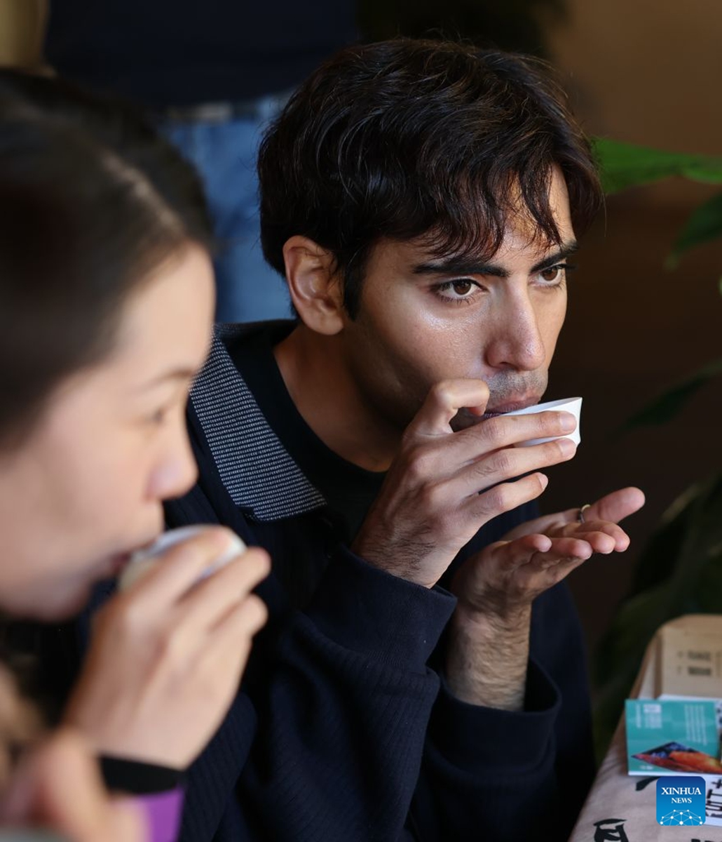 Visitors taste tea during a fair called Tea for Harmony and Dragon Boat Festival Cultural Fair in Sydney held at a park in Sydney, Australia, June 20, 2026. Photo: Xinhua