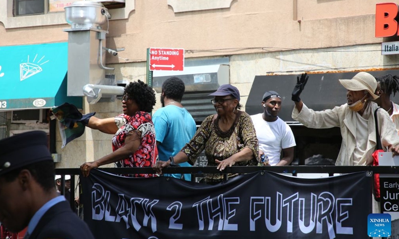 People attend a Juneteenth parade in Staten Island, New York City, the United States, on June 19, 2026. Celebrated on June 19, Juneteenth marks the day in 1865 when Union Major General Gordon Granger issued General Order No. 3 in Galveston, Texas, emancipating the remaining enslaved people in the state. For enslaved Americans in Texas, freedom came two and a half years after President Abraham Lincoln issued the Emancipation Proclamation. (Xinhua/Zhang Fengguo)