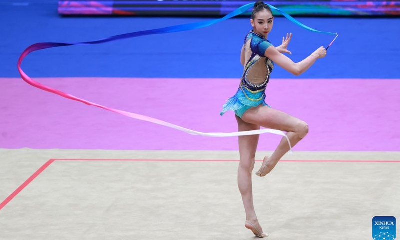 Wang Qi of China competes during the ribbon match of individual all-around final at the 2026 Rhythmic Gymnastics World Challenge Cup Beijing in Beijing, China, June 19, 2026. (Photo by Ma Zihan/Xinhua)
