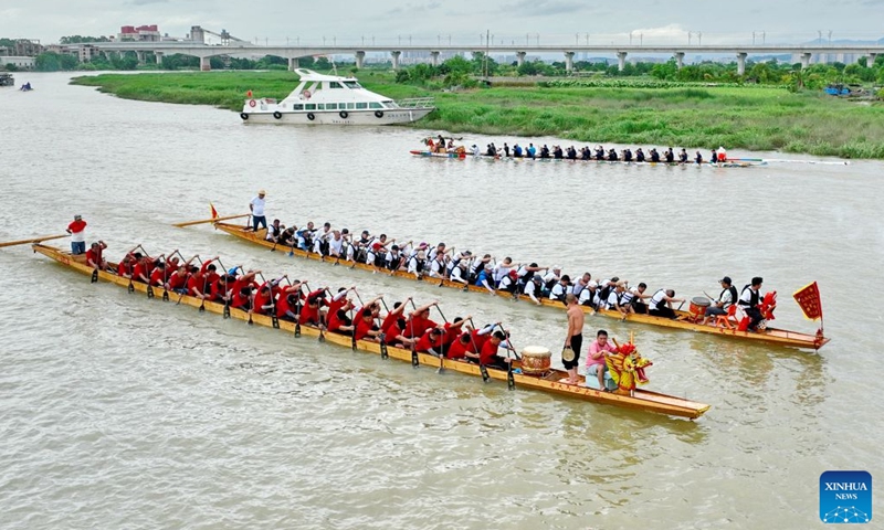 People compete in a dragon boat race on Shanggan section of the Taojiang River in Minhou County, Fuzhou of southeast China's Fujian Province, June 18, 2026. The Dragon Boat Festival, also known as Duanwu Festival, is a traditional Chinese holiday to commemorate ancient Chinese poet Qu Yuan from the Warring States Period (475-221 B.C.). Celebrated on the fifth day of the fifth month of the Chinese lunar calendar, the festival falls on June 19 this year. (Xinhua/Lin Shanchuan)
