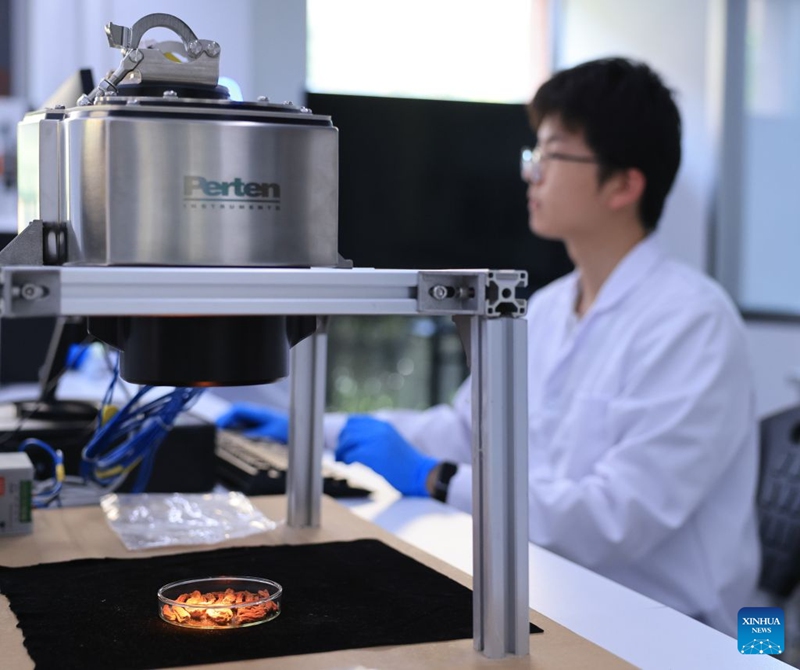 A staff member conducts tests using a near-infrared spectrometer at the National Modern TCM Innovation Center in north China's Tianjin, June 18, 2026. The National Modern TCM Innovation Center has been dedicated to improving the quality and efficiency of the traditional Chinese medicine (TCM) industry. It focuses on areas such as high-quality TCM material supply, modernized TCM production, intelligent transformation of equipment, and market-oriented application. Photo: Xinhua