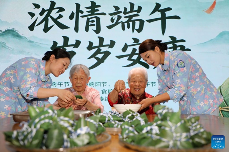 Senior citizens and staff members make Zongzi together at an elderly care center in Boxing County of Binzhou City, east China's Shandong Province, June 20, 2026. Friday marks the Duanwu Festival, or Dragon Boat Festival, a traditional festival celebrated on the 5th day of the 5th month in the traditional Chinese calendar.

The festival is best known for holding dragon boat race, eating Zongzi, sticky rice dumplings wrapped with bamboo or reed leaves, and hanging mugwort and calamus as symbol of health and protection. Photo: Xinhua