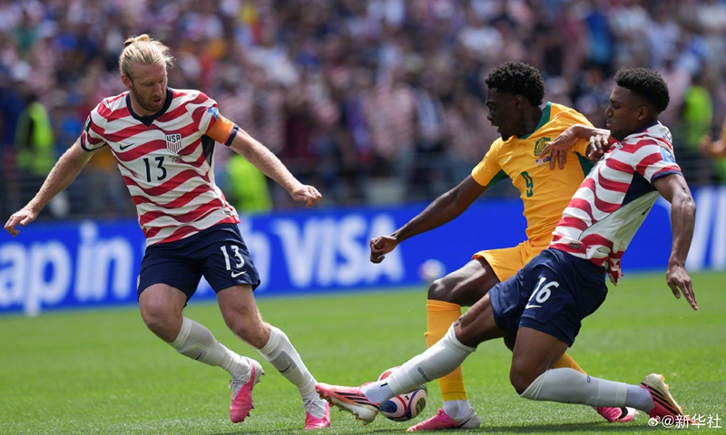Mohamed Toure (C) of Australia vies with Tim Ream (L) and Alex Freeman of the United States during the group D match between the United States and Australia at the 2026 FIFA World Cup at Seattle Stadium in Seattle, the United States, June 19, 2026. (Xinhua/Peng Ziyang)