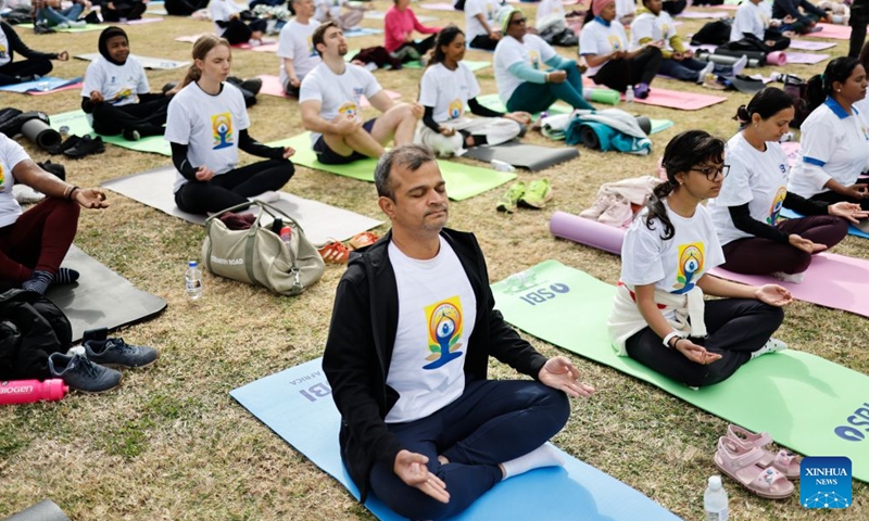 People take part in a yoga session to celebrate the International Day of Yoga in Johannesburg, South Africa, June 20, 2026. (Photo by James Blackmore/Xinhua)