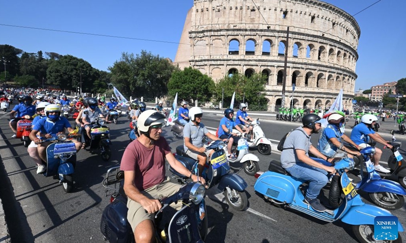 Vespa enthusiasts parade around the Colosseum during a celebration marking the 80th anniversary of the iconic Italian brand of scooters, in Rome, Italy, on June 27, 2026. (Photo by Alberto Lingria/Xinhua)

