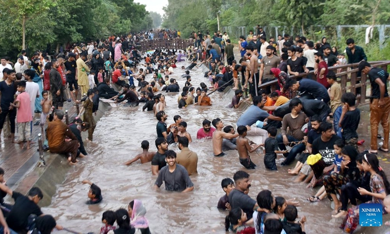 People cool off themselves during a heat wave in a canal in Lahore, Pakistan on July 4, 2026. (Photo by Sajjad/Xinhua)