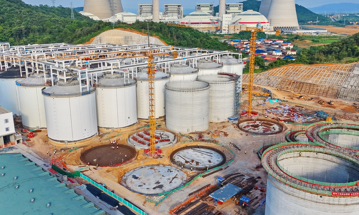 Workers install grain storage equipment at a Sinograin warehouse construction site in Hukou county, East China's Jiangxi Province, on June 21, 2026. The project will enhance the local capacity to serve the nation's macro-control over grain supplies, and play a vital role in stabilizing market grain prices. Photo: VCG