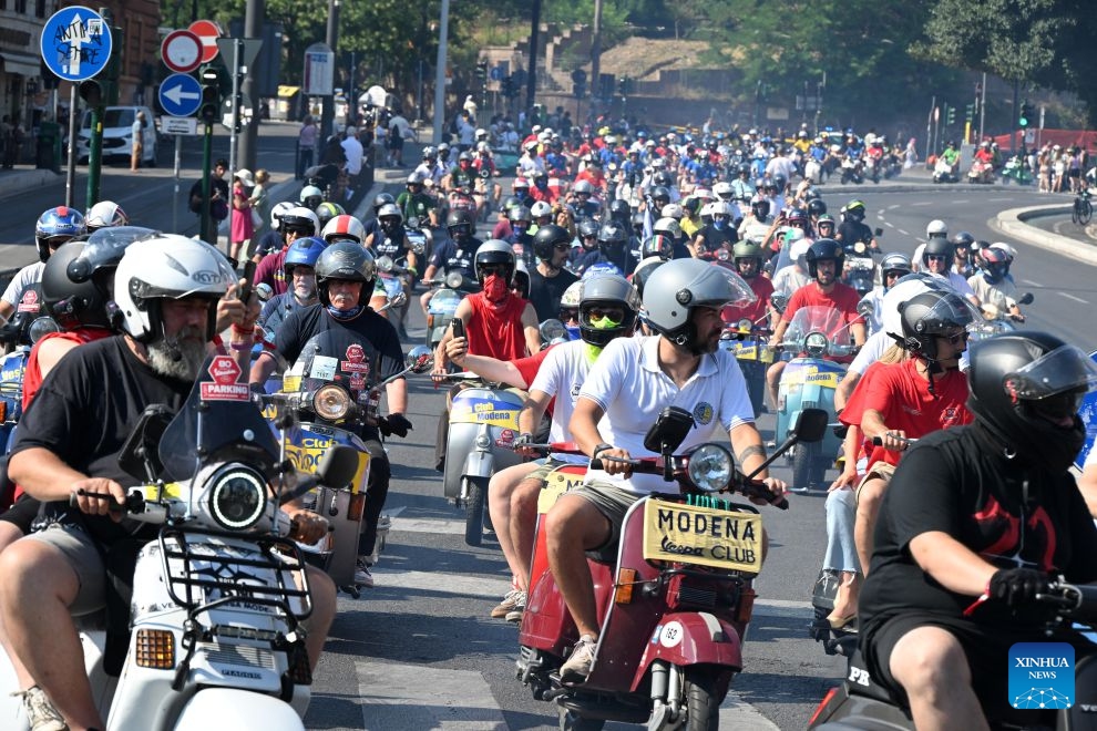 Vespa enthusiasts parade around the Colosseum during a celebration marking the 80th anniversary of the iconic Italian brand of scooters, in Rome, Italy, on June 27, 2026. (Photo by Alberto Lingria/Xinhua)

