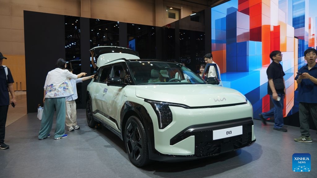 People visit the Kia display area during the Busan International Mobility Show 2026 (BIMOS 2026) in Busan, South Korea, June 27, 2026. The BIMOS 2026 runs from June 26 to July 5 this year. (Photo by Sun Yiran/Xinhua)

