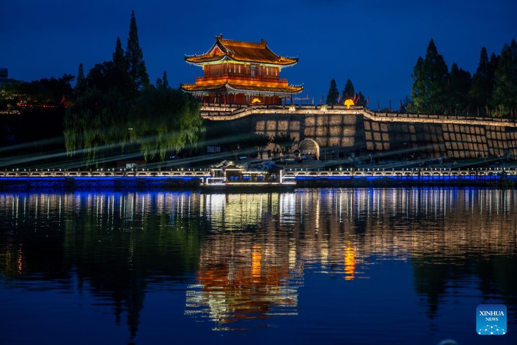 This photo taken on June 25, 2026 shows a night view of the Jingzhou ancient town in Jingzhou, central China's Hubei Province. Hubei, dubbed the province of a thousand of lakes, has done a lot of work in the comprehensive management of its rivers and lakes, in an effort to improve its water ecology and water environment. (Xinhua/Du Zixuan)

