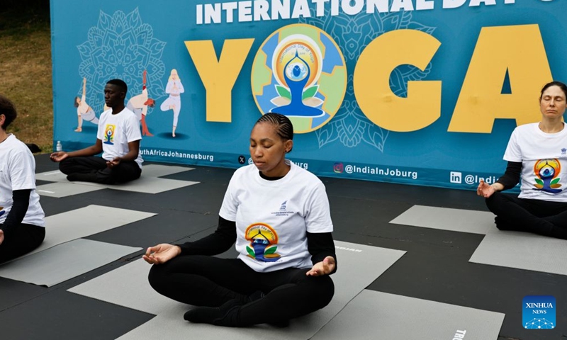 People take part in a yoga session to celebrate the International Day of Yoga in Johannesburg, South Africa, June 20, 2026. (Photo by James Blackmore/Xinhua)