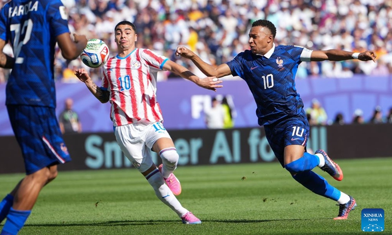 Kylian Mbappe (R) of France vies with Miguel Almiron of Paraguay during the round of 16 match between France and Paraguay at the 2026 FIFA World Cup at Philadelphia Stadium in Philadelphia, the United States, July 4, 2026. (Xinhua/Lui Siu Wai)

