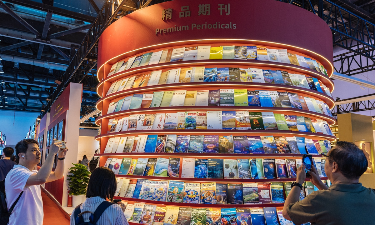 Visitors take photos of periodicals at the 2026 Beijing International Book Fair on June 17, 2026. Photos: Li Hao/GT