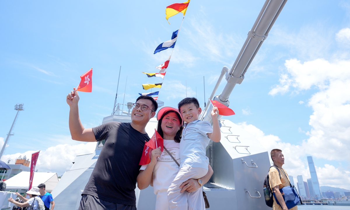 A Hong Kong family visits the Chinese People's Liberation Army (PLA) Navy ship Suqian at an open day at the PLA Hong Kong Garrison at Ngong Shuen Chau Barracks in Hong Kong on June 21, 2026. Photo: VCG