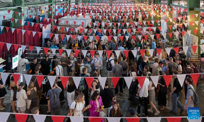 This photo taken on June 20, 2026 shows a scene of the Open Coffee Fest in St. Petersburg, Russia. The fest is held here from June 20 to 21. Baristas from all over Russia demonstrate their skills, attracting many citizens to taste coffee. (Photo by Guo Feizhou/Xinhua)

