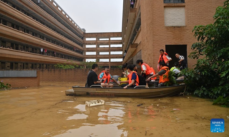 Rescuers evacuate stranded students at Xijiang education park in Guigang, south China's Guangxi Zhuang Autonomous Region, July 8, 2026. Triggered by Typhoon Maysak, the tenth typhoon of the year, heavy downpours battered multiple areas in south China's Guangxi Zhuang Autonomous Region, resulting in a series of disasters. Various response forces have pooled their efforts, carrying out operations including rescue missions in remote mountainous areas, restoration of transport and power infrastructure, and silt clearing operations. (Xinhua/Zhou Hua)