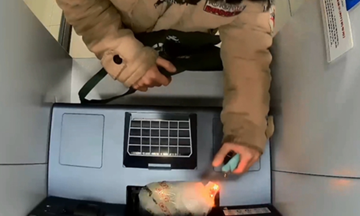 A man attempts to steal money by blowing up an ATM in a bank in Minhang district, Shanghai on January 18, 2025. Photo: Courtesy of Knews under Shanghai Media Group