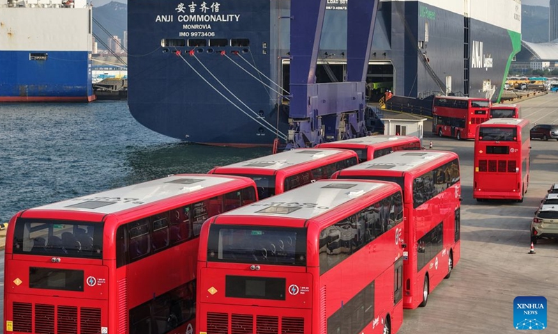 A drone photo taken on July 5, 2026 shows homemade electric double-decker buses heading to a car carrier at Yantai Port in Yantai, east China's Shandong Province.
A total of twenty-two BYD electric double-decker buses on Sunday were shipped from Yantai Port to the United Kingdom. The buses will subsequently be put into service in London's public transport system. (Photo by Tang Ke/Xinhua)