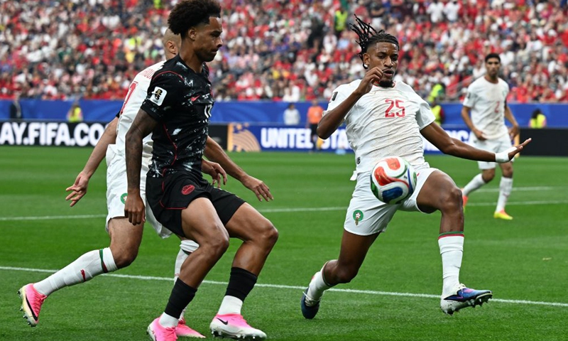 Redouane Halhal (R) of Morocco competes with Tajon Buchanan (C) of Canada during the round of 16 match between Canada and Morocco at the 2026 FIFA World Cup at Houston Stadium in Houston, the United States, July 4, 2026. (Xinhua/Xiao Yijiu)

