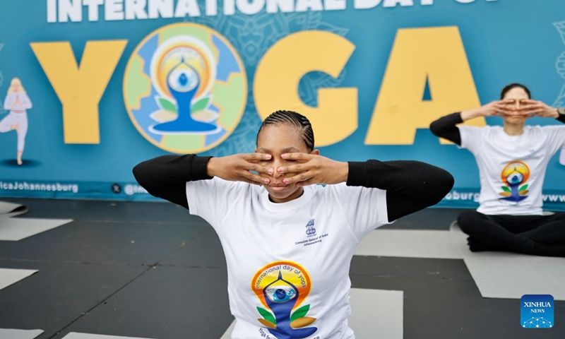People take part in a yoga session to celebrate the International Day of Yoga in Johannesburg, South Africa, June 20, 2026. (Photo by James Blackmore/Xinhua)