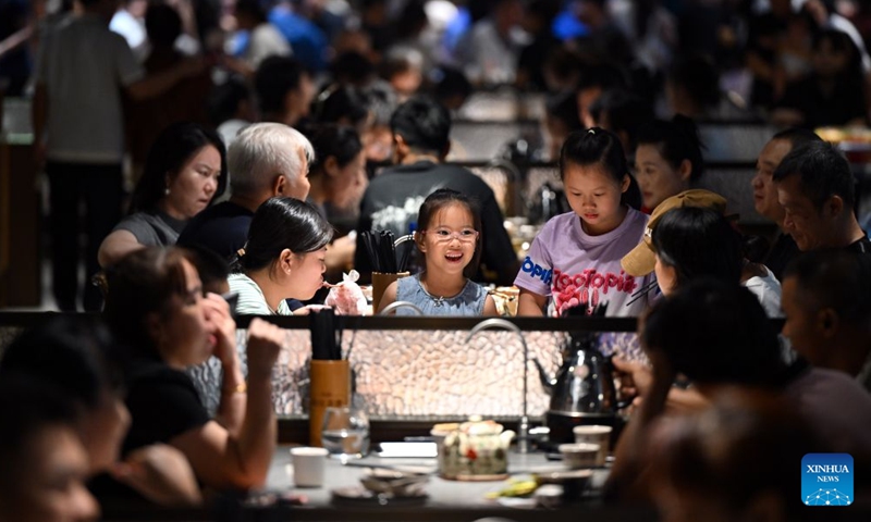 Tourists enjoy Laobacha dishes at a teahouse in Haikou, south China's Hainan Province, July 4, 2026.
Laobacha, or literally old dad tea, refers to a teahouse culture endemic to the island province of Hainan. Offering an array of teas, pastries, and dim sum, Laobacha is a byword for the islanders' relaxed pace of life. (Xinhua/Guo Cheng)
