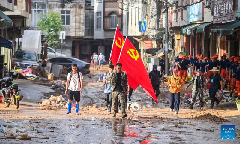 Rescuers are seen in Zhenlong Township of Hengzhou, south China's Guangxi Zhuang Autonomous Region, July 11, 2026. Triggered by Typhoon Maysak, the tenth typhoon of the year, heavy downpours battered multiple areas in south China's Guangxi Zhuang Autonomous Region, resulting in a series of disasters. Various response forces have pooled their efforts, carrying out operations including rescue missions in remote mountainous areas, restoration of transport and power infrastructure, and silt clearing operations. (Xinhua/Huang Xiaobang)