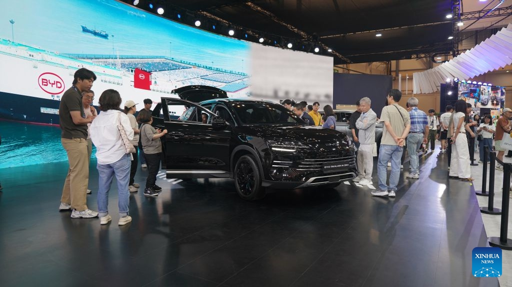 People visit the BYD display area during the Busan International Mobility Show 2026 (BIMOS 2026) in Busan, South Korea, June 27, 2026. The BIMOS 2026 runs from June 26 to July 5 this year. (Photo by Sun Yiran/Xinhua)

