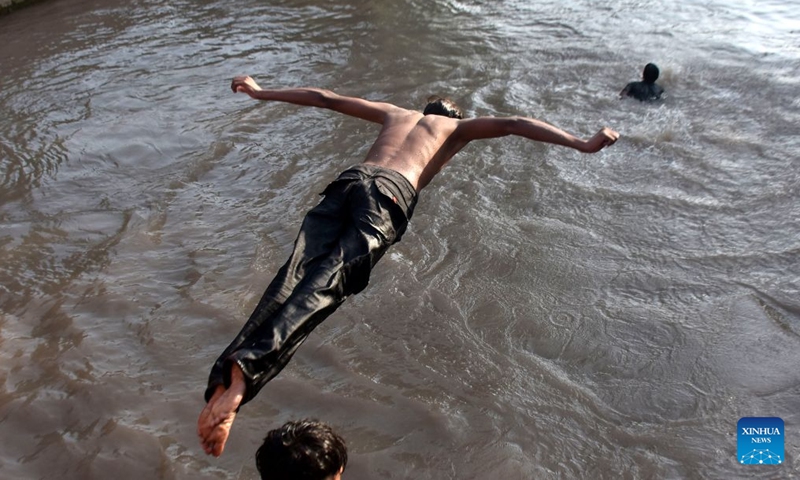 A man jumps into the water during a heat wave in a canal in Lahore, Pakistan on July 4, 2026. (Photo by Sajjad/Xinhua)