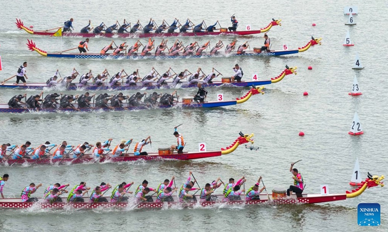 Liao Kangni participates in the 2026 Hunan Dragon Boat Super League as a member of the No.6 Luojiang Township Dragon Boat Team in Miluo City, central China's Hunan Province, June 18, 2026.