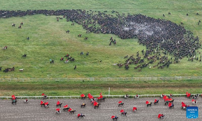 An aerial drone photo shows a horse galloping performance at the opening ceremony of the 2026 Zhaosu Tianma cultural tourism festival in Zhaosu County, northwest China's Xinjiang Uygur Autonomous Region, June 20, 2026.

The 2026 Zhaosu Tianma cultural tourism festival kicked off here on Saturday. (Xinhua/Hu Huhu)