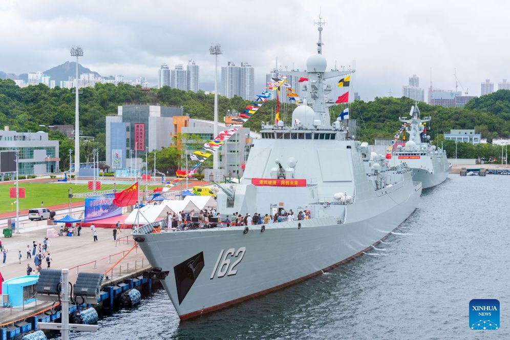 People attend an open-house event at the Chinese People's Liberation Army (PLA) Hong Kong Garrison's naval base on Stonecutters Island in south China's Hong Kong, July 4, 2026. A Chinese People's Liberation Army (PLA) Navy fleet opens to Hong Kong and Macao residents and students from Friday through Sunday.