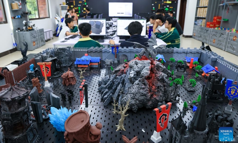 Students take a 3D printing class at a school in Shenzhen, south China's Guangdong Province, June 2, 2026. In recent years, consumer 3D printers have transformed from laboratory niche black technology to popular consumer products, covering different fields from home DIY and campus education to entrepreneurial innovation and large-scale production. (Xinhua/Mao Siqian)

