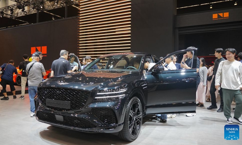 People visit the Genesis display area during the Busan International Mobility Show 2026 (BIMOS 2026) in Busan, South Korea, June 27, 2026. The BIMOS 2026 runs from June 26 to July 5 this year. (Photo by Sun Yiran/Xinhua)


