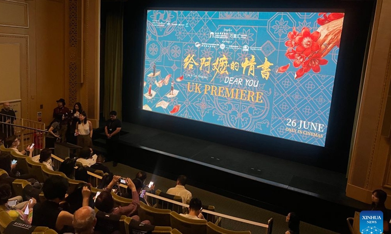 Audience take pictures of the screen ahead of the premiere of Chinese film Dear You at a cinema in London, Britain, June 20, 2026. China's word-of-mouth movie sensation Dear You held its British premiere in central London on Saturday, ahead of its theatrical release in Britain and Ireland on June 26. (Xinhua/Zhao Jiasong)