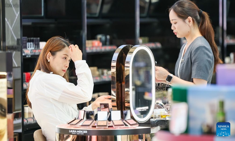 A customer shops at the Haikou International Duty Free Shopping Complex during the Dragon Boat Festival holiday in Haikou, south China's Hainan Province, June 20, 2026. (Xinhua/Yang Guanyu)