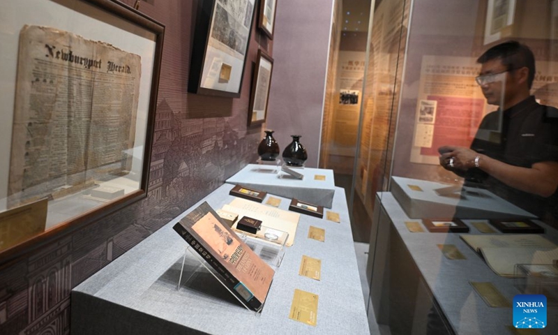 A visitor looks at exhibits during an exhibition in Beijing, capital of China, June 27, 2026. The exhibition highlighting friendly exchanges between the civilian sectors of China and the United States has opened at the Overseas Chinese History Museum of China in Beijing. The exhibition features a selection of 100 relics, including gold-mining tools, railroad spikes, documents and newspapers, as well as badges marking the war against Japanese aggression, showcasing the contributions made by generations of overseas Chinese throughout U.S. history. (Xinhua/Jin Liangkuai)

