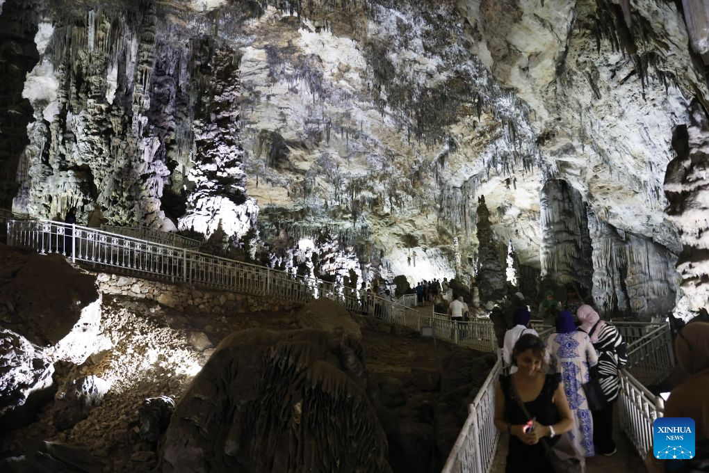 People visit the Beni Add caves in Tlemcen, Algeria, Aug. 17, 2026. The main gallery of Beni Add caves extend over 700 meters, with a depth reaching 57 meters, and are home to stalactites and stalagmites of varied shape. (Photo by Billel Bensalem/Xinhua)