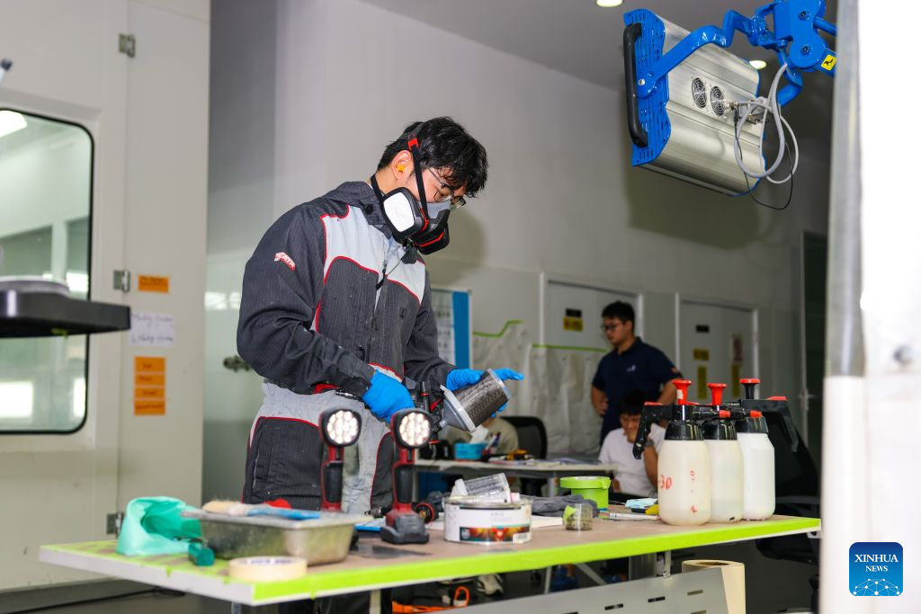 Duan Libo trains for the car painting skill competition of the 48th WorldSkills Competition at a training facility of Hangzhou Technician Institute in Hangzhou, east China's Zhejiang Province, Sept. 7, 2026. (Xinhua/Jiang Han)