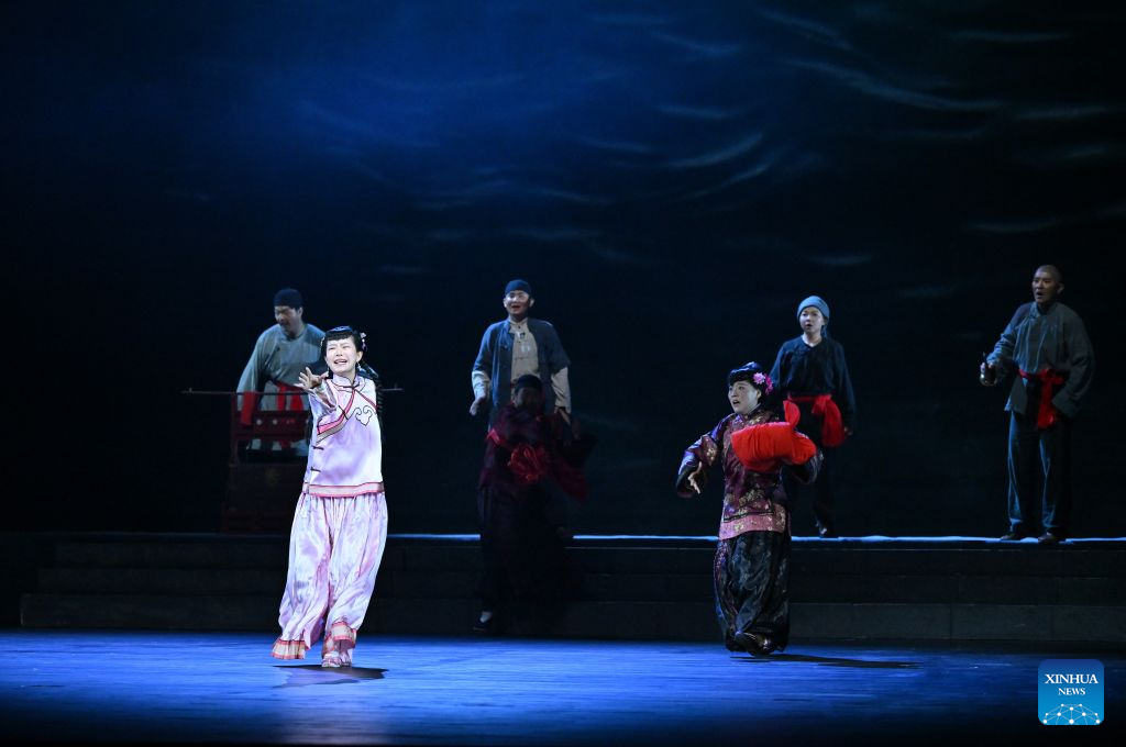 Actors perform a play during the seventh ethnic minority art festival in Beijing, capital of China, Aug. 18, 2026. The festival is held in Beijing from Aug. 18 to Sept. 23. (Xinhua/Han Xu)